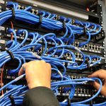 Man's Hands on Data Cables